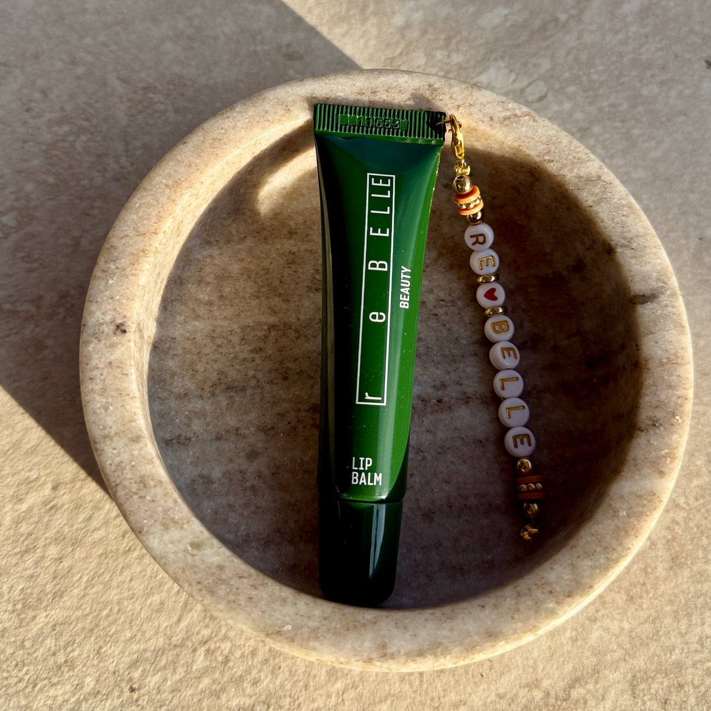 The Lip Balm with reBELLE Chain